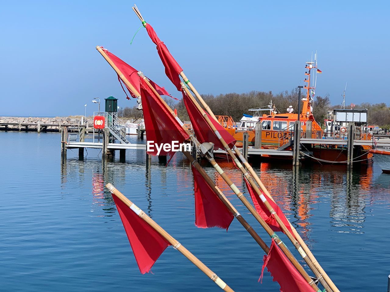 FISHING BOAT IN LAKE AGAINST SKY