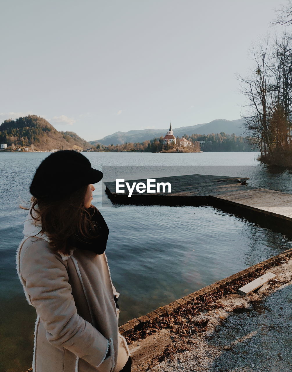 Side view of woman looking at lake traveling