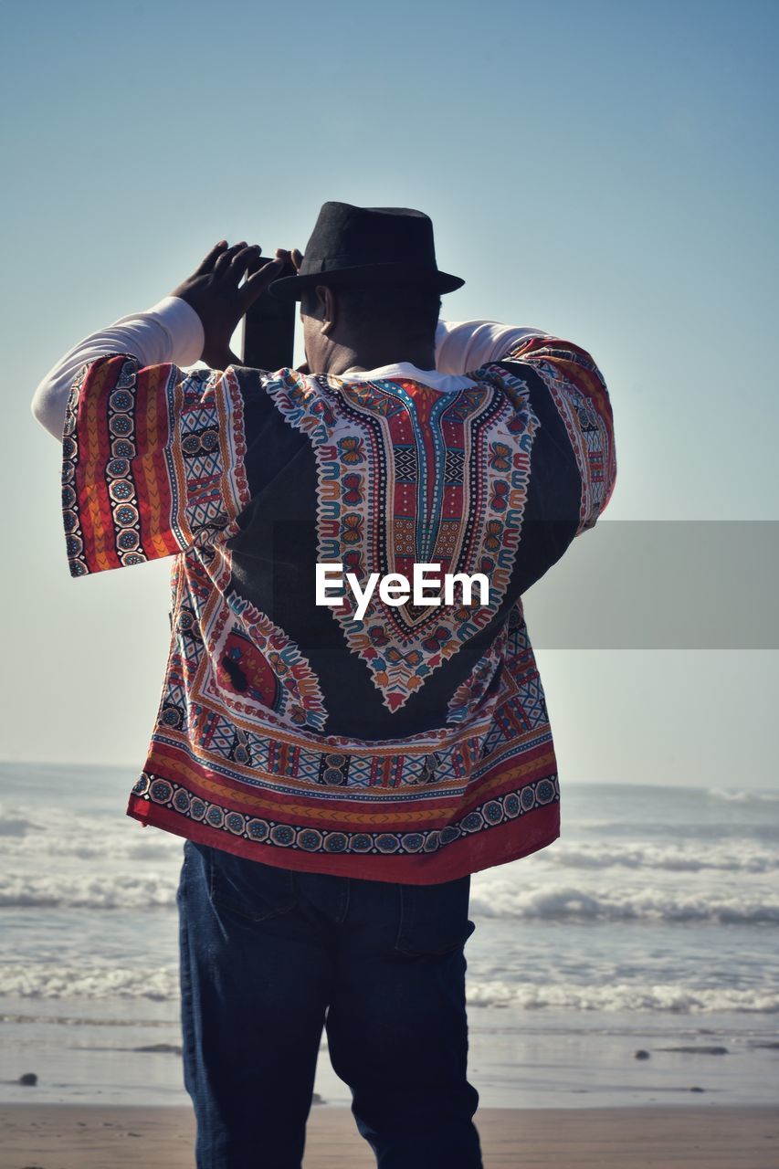 Man taking picture of beach