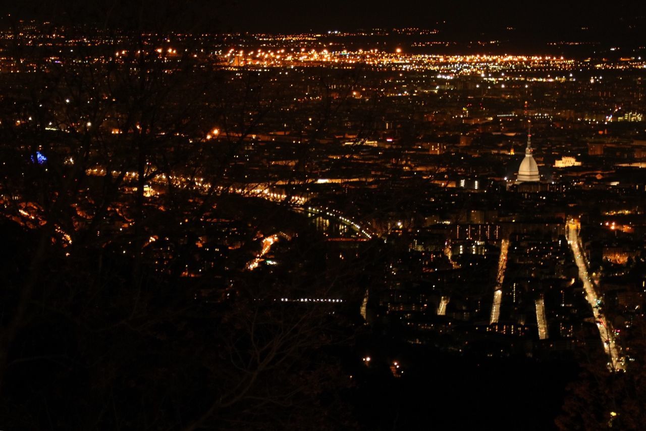 AERIAL VIEW OF ILLUMINATED CITYSCAPE