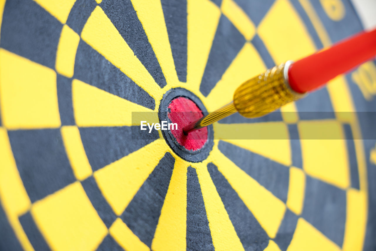 Close-up of arrow on dartboard