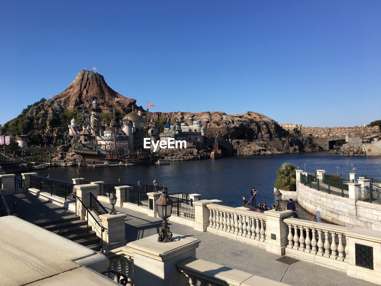 Scenic view of town against blue sky