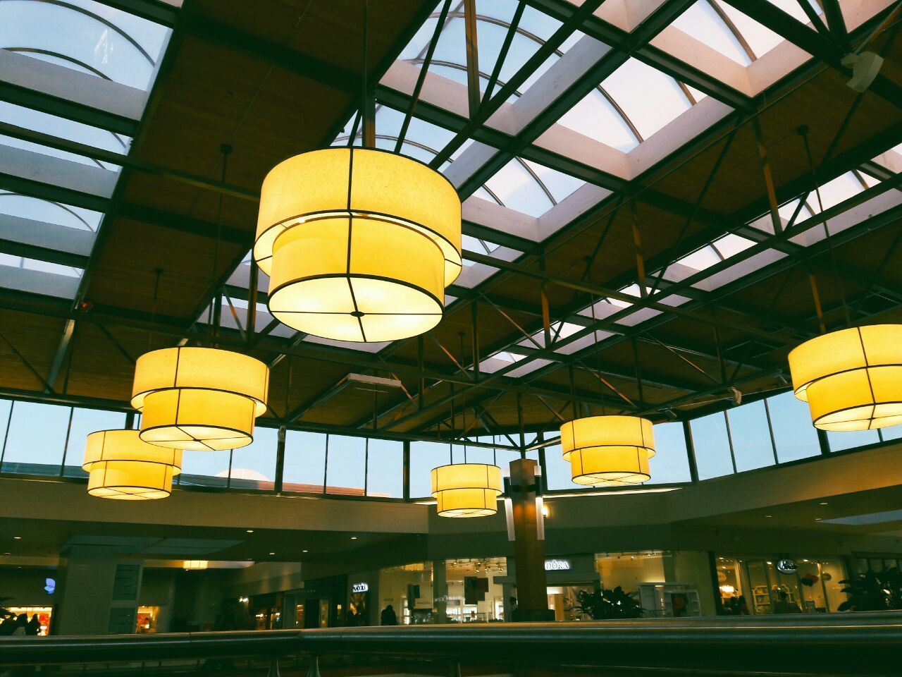 LOW ANGLE VIEW OF ILLUMINATED HANGING FROM CEILING