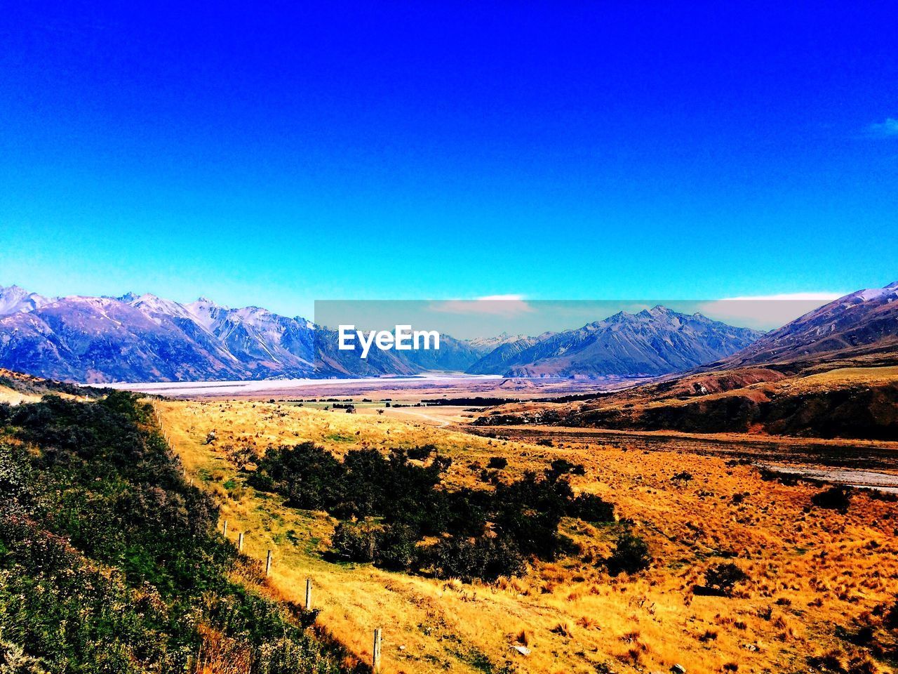 SCENIC VIEW OF LANDSCAPE AGAINST CLEAR BLUE SKY