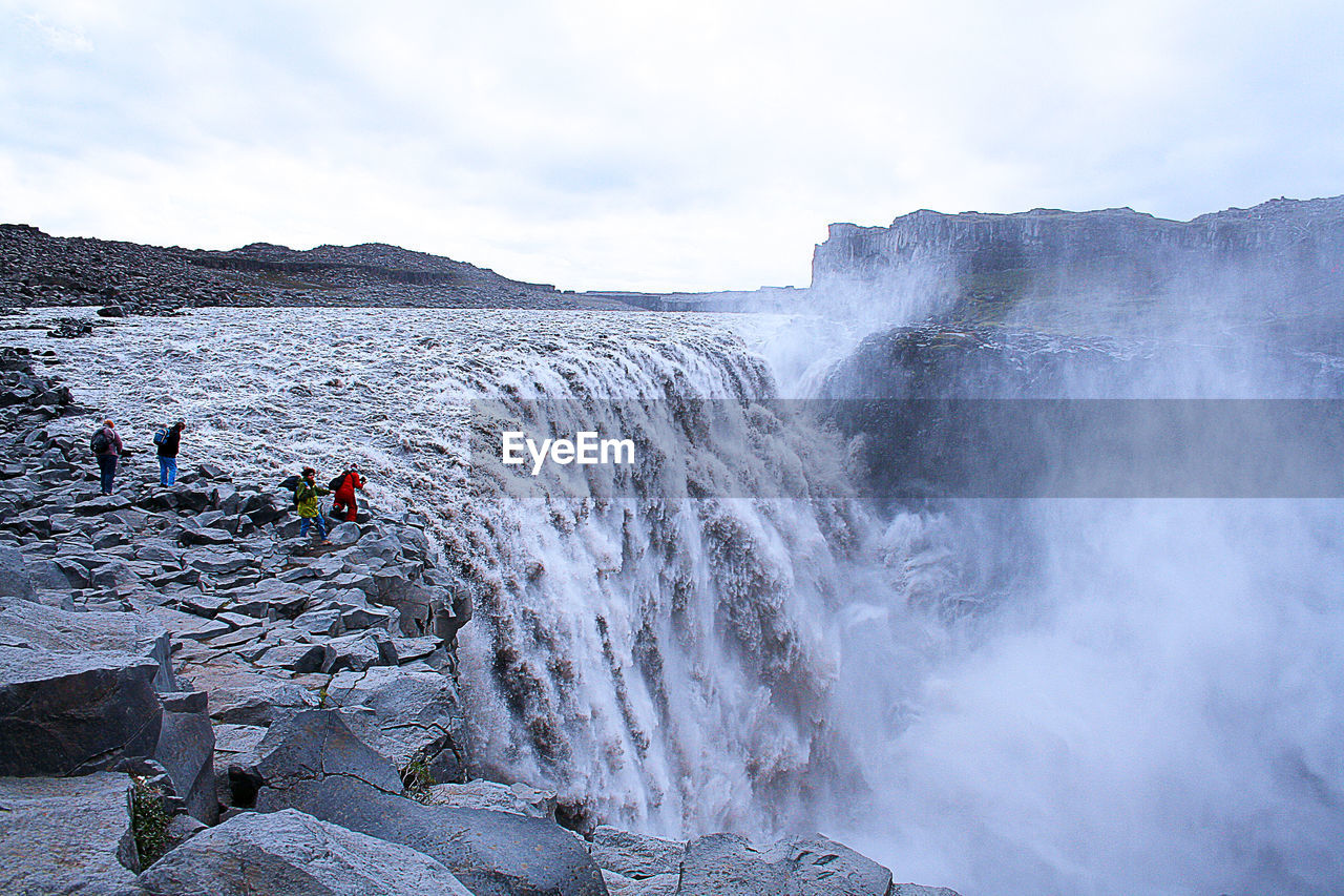 Scenic view of dettifoss waterfall, in iceland,  against sky