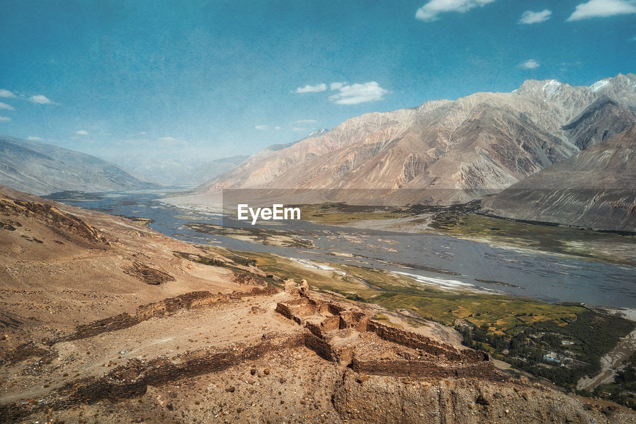 Scenic view of lake and mountains against sky