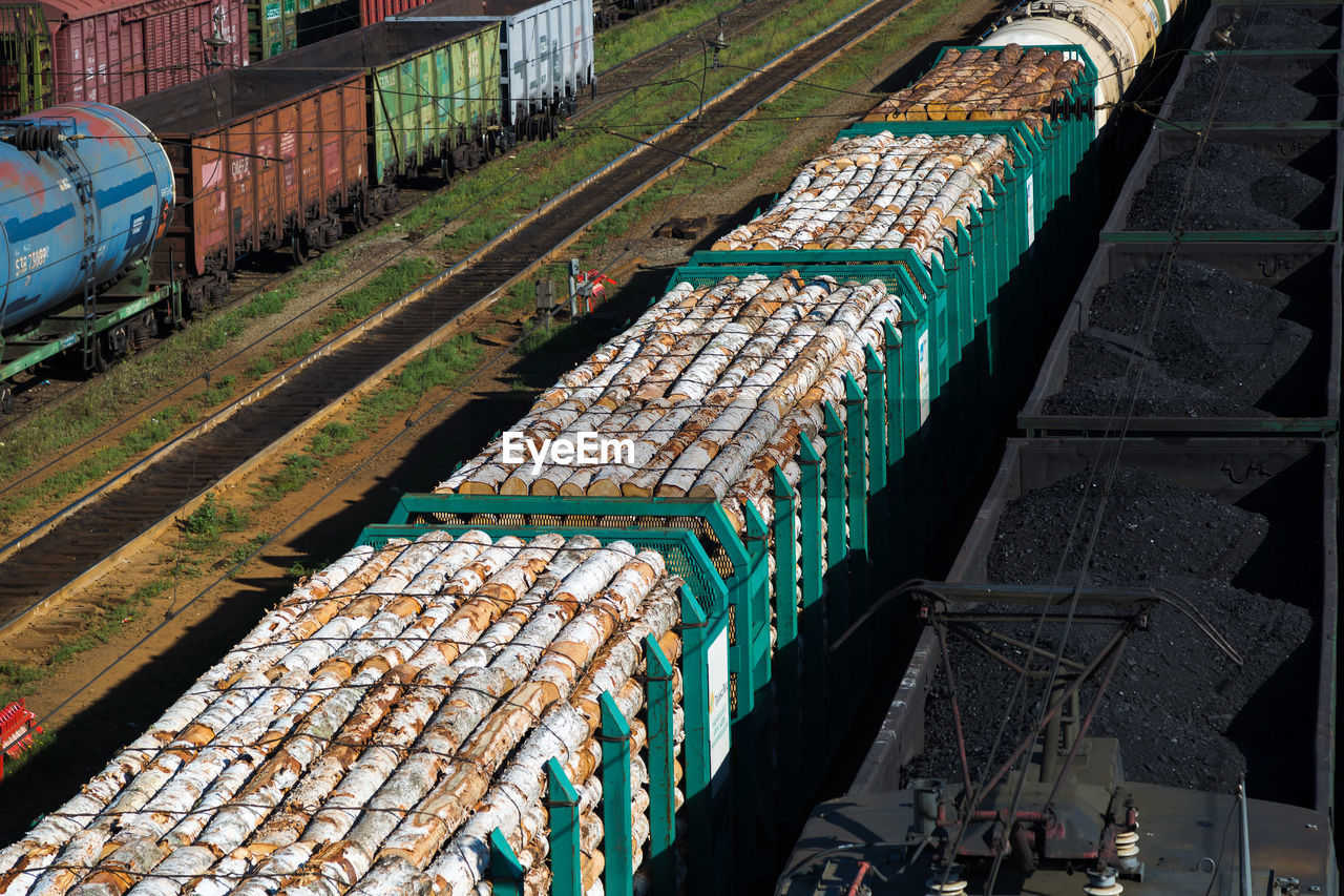 Omsk, russia - july 24, 2021, railway cars with coal wood. editorial.
