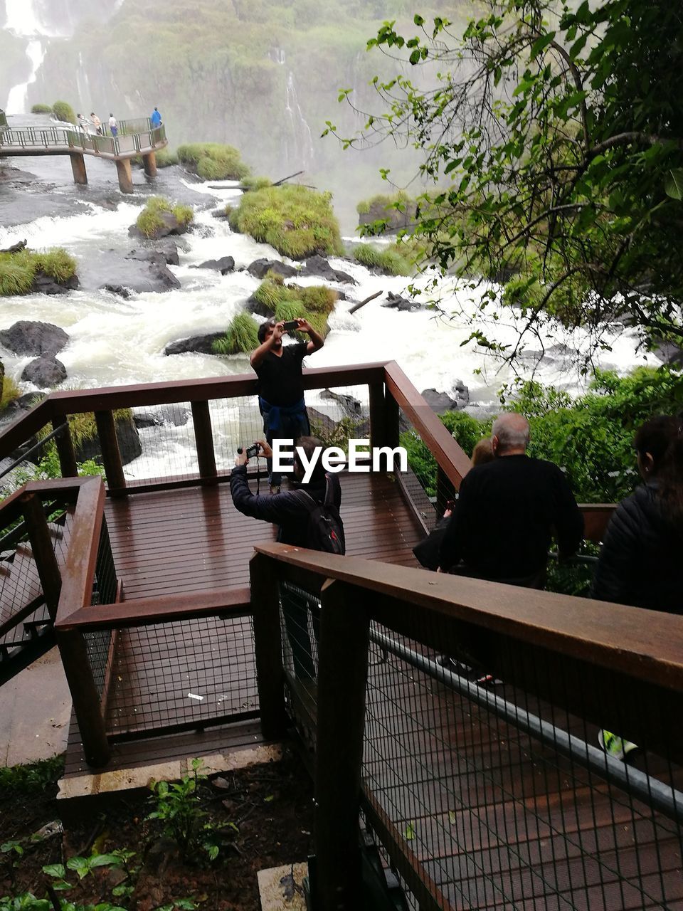 People by river at observation point