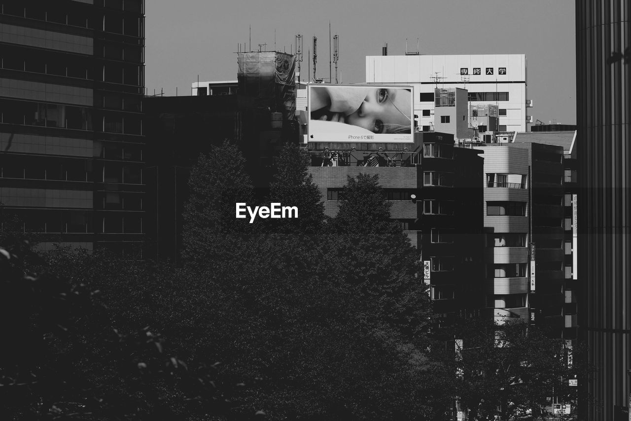 Low angle view of buildings and trees