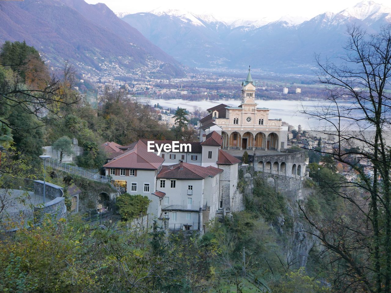 High angle view of church in town against mountains