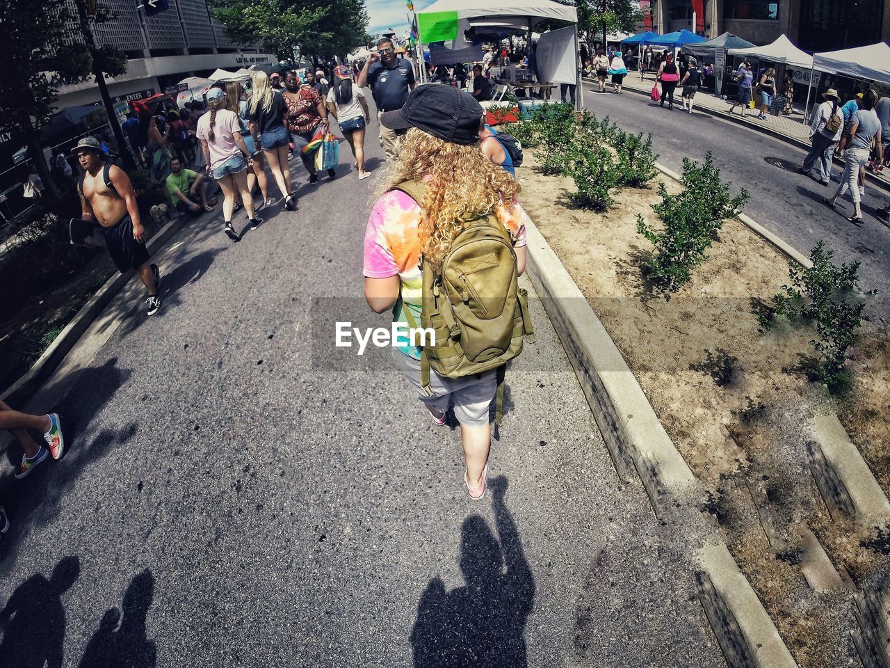 HIGH ANGLE VIEW OF PEOPLE ON STREET