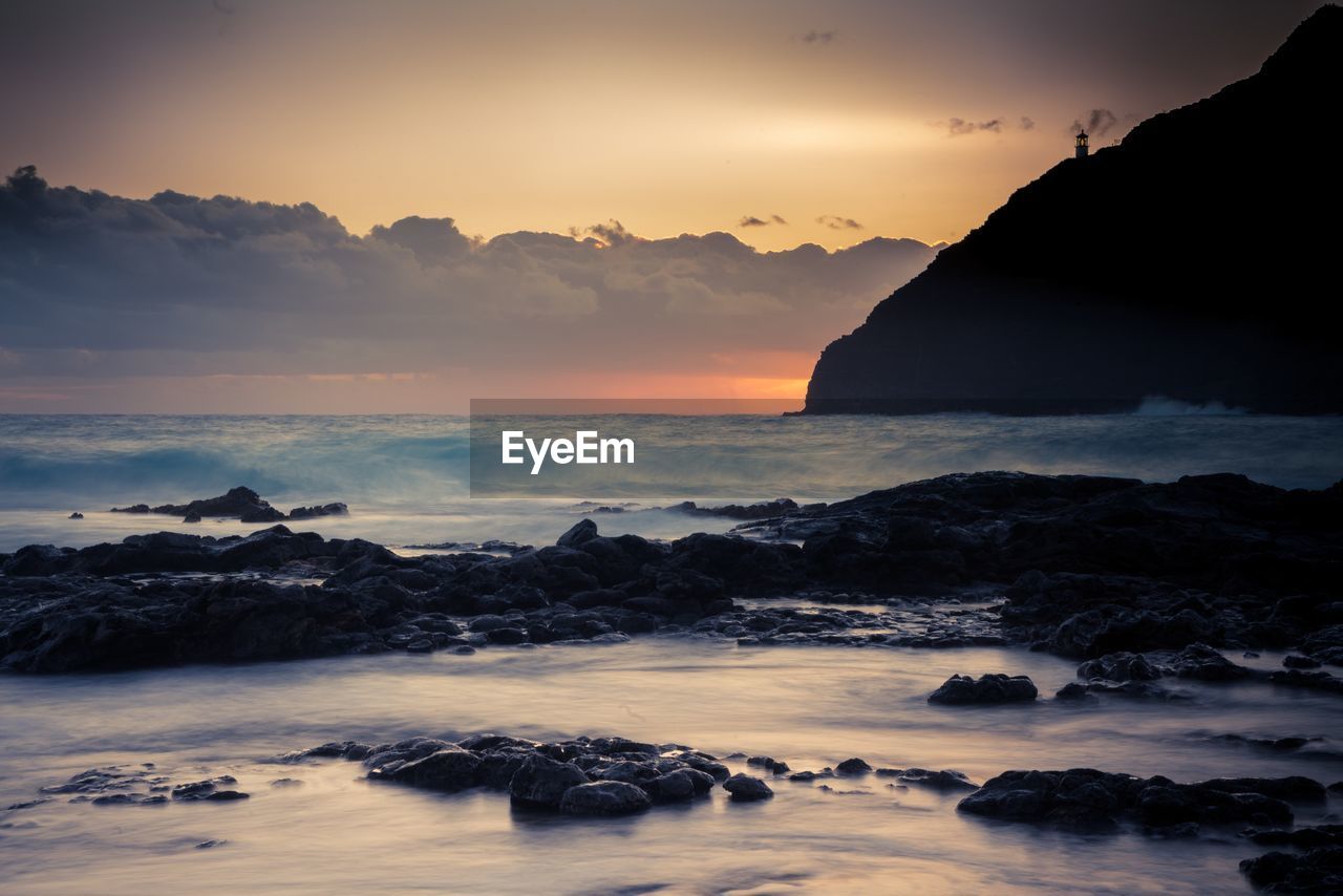 Scenic view of sea against sky during sunset