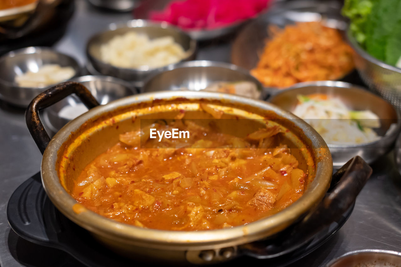 food, food and drink, healthy eating, dish, freshness, asian food, vegetable, wellbeing, kitchen utensil, cuisine, no people, meat, bowl, soup, meal, indoors, spice, household equipment, curry, indian food, cooking pan, close-up, stew, produce, savory food, table, focus on foreground, selective focus, heat