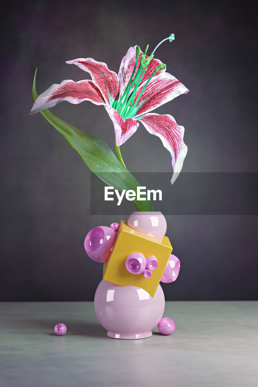 CLOSE-UP OF MULTI COLORED FLOWERS ON TABLE