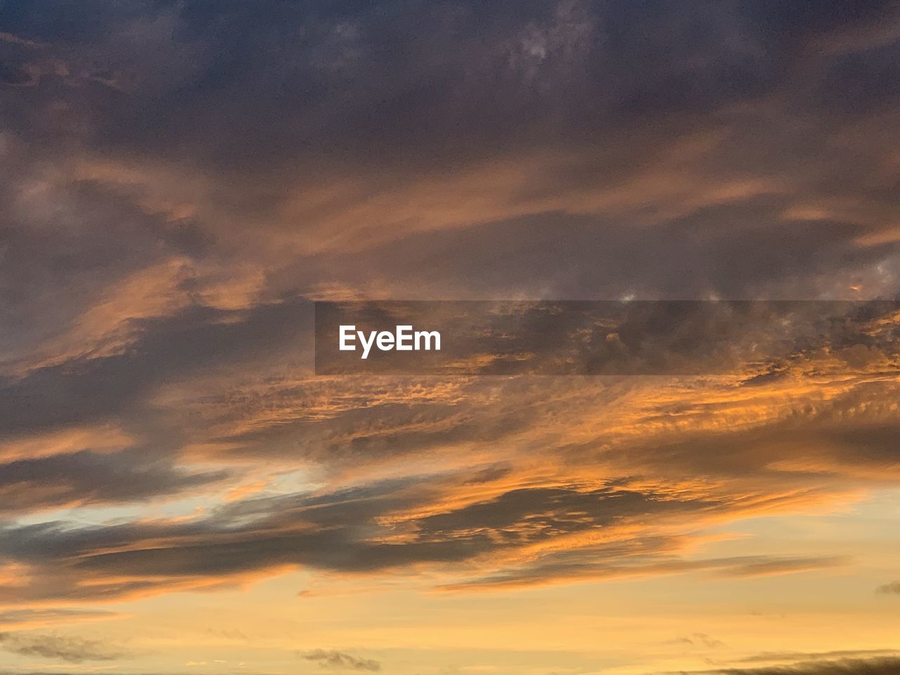 Low angle view of dramatic sky during sunset