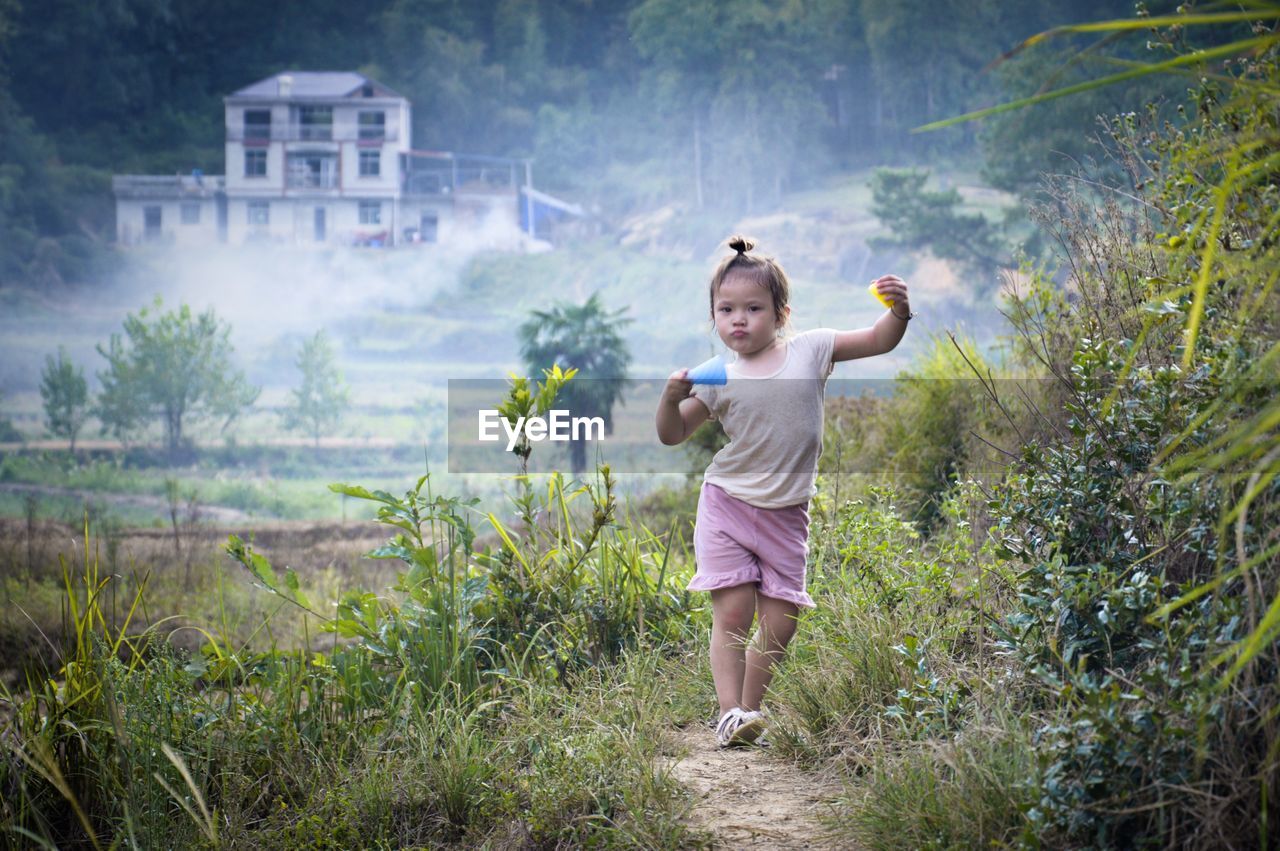 Powerfull walking kid with natural background