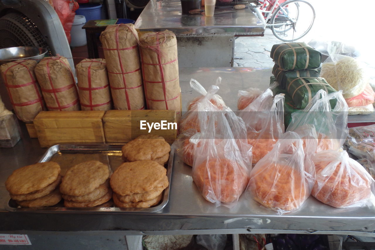 High angle view of food in plastic bags at market stall for sale