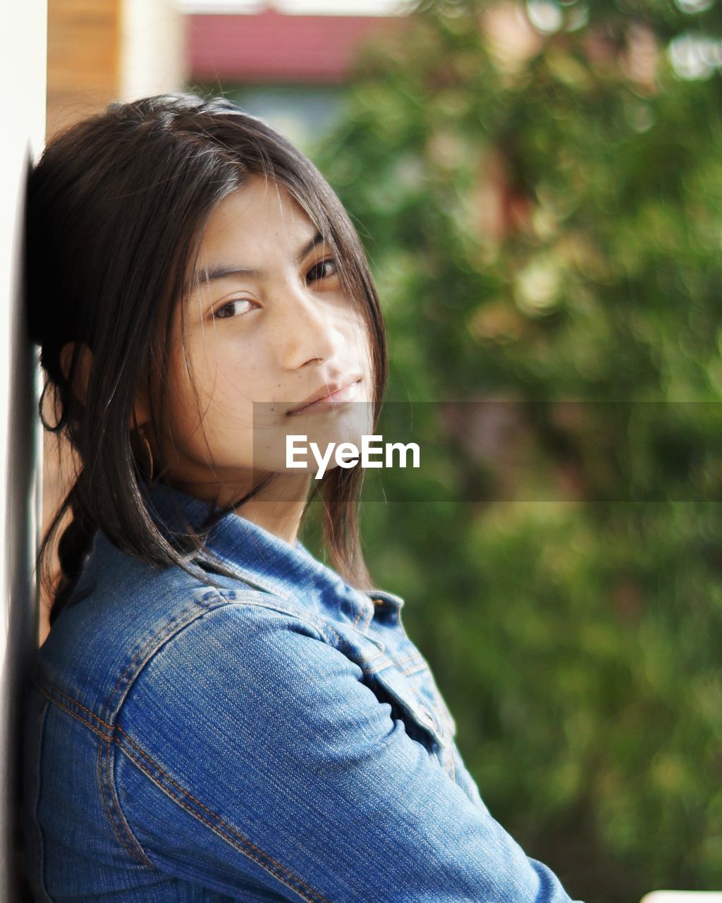 Side view portrait of young woman outdoors