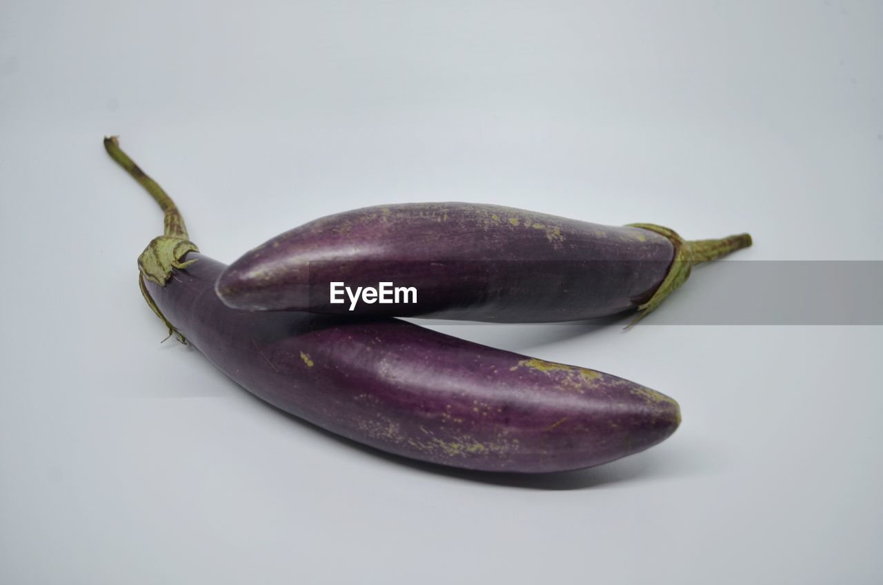 Close-up of eggplant on table against white background