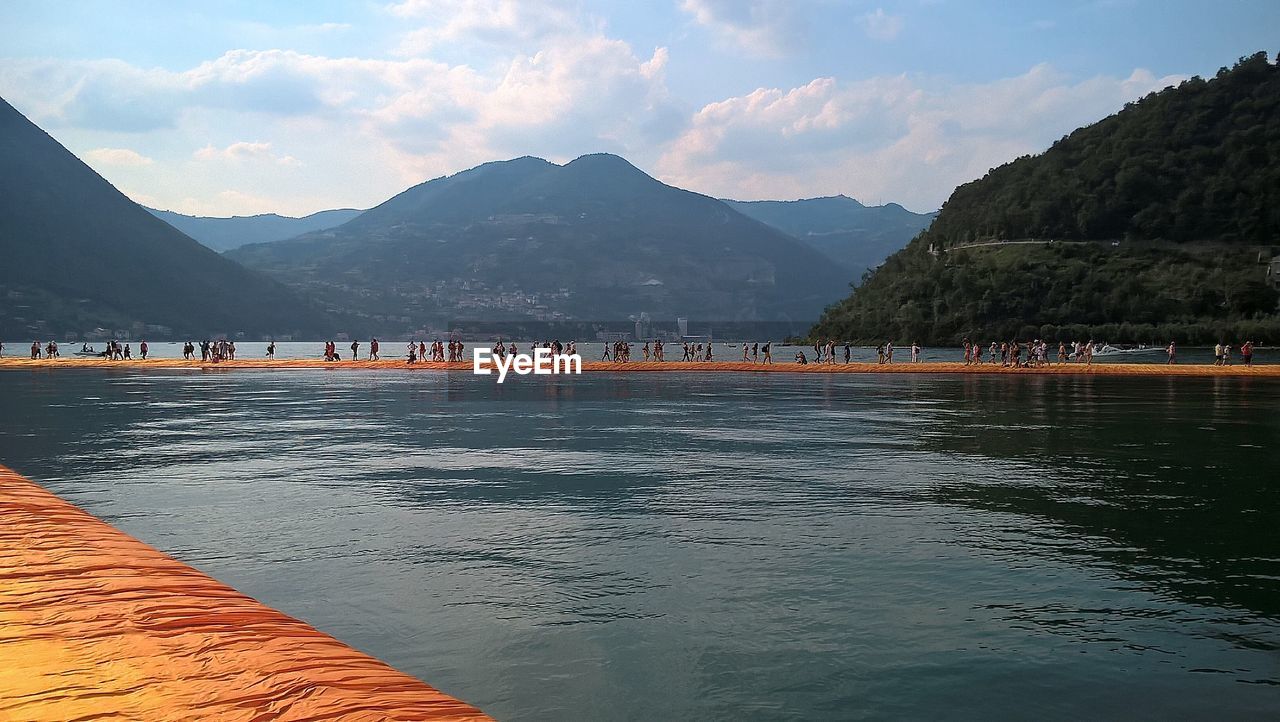 SCENIC VIEW OF RIVER AND MOUNTAINS AGAINST SKY