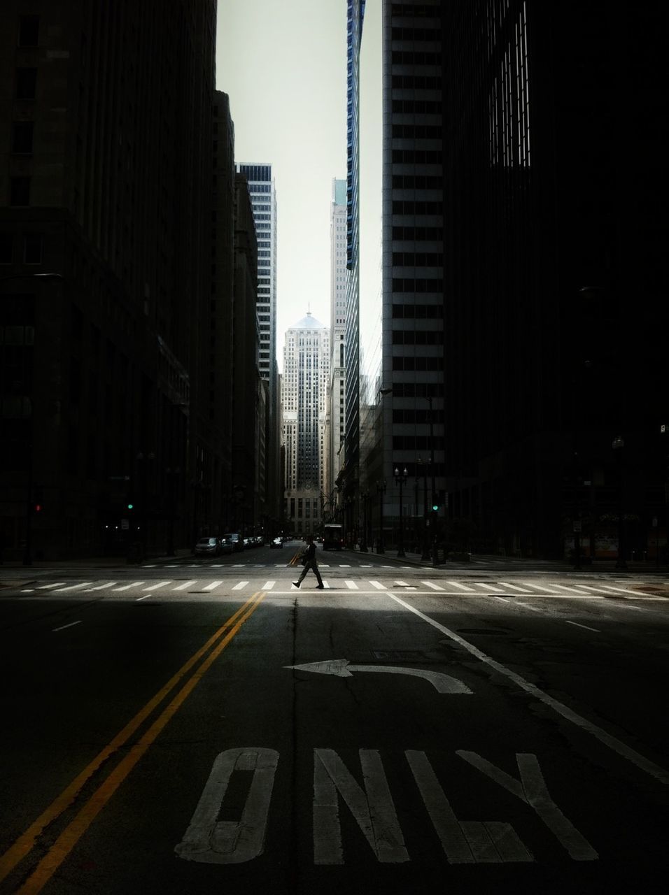 Distance shot of man on pedestrian crossing