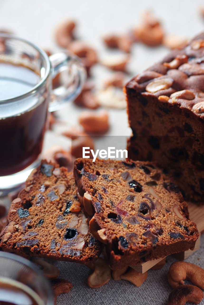 Sliced fruit cake with a cup of coffee