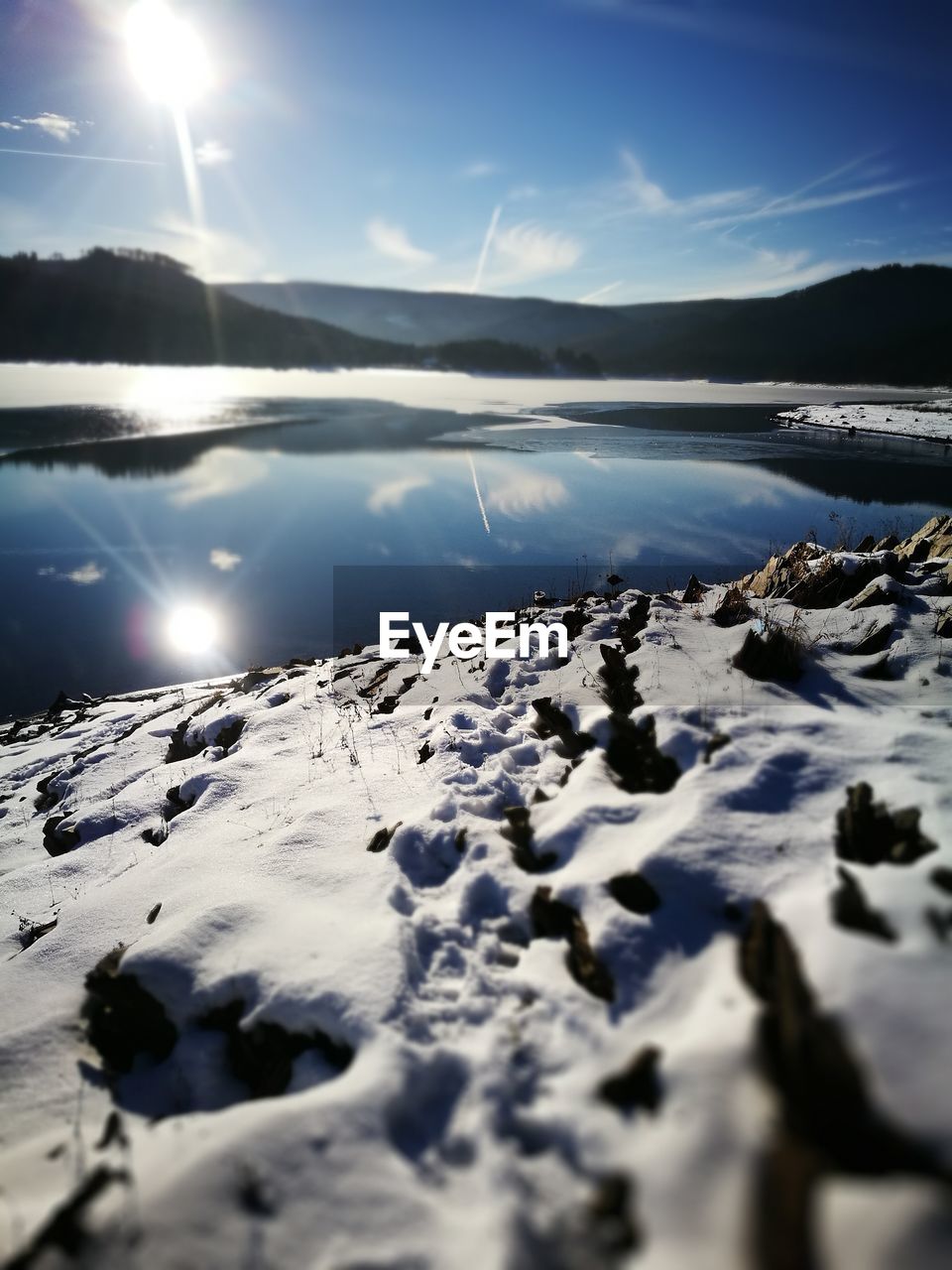 SCENIC VIEW OF SNOW COVERED LANDSCAPE AGAINST SKY