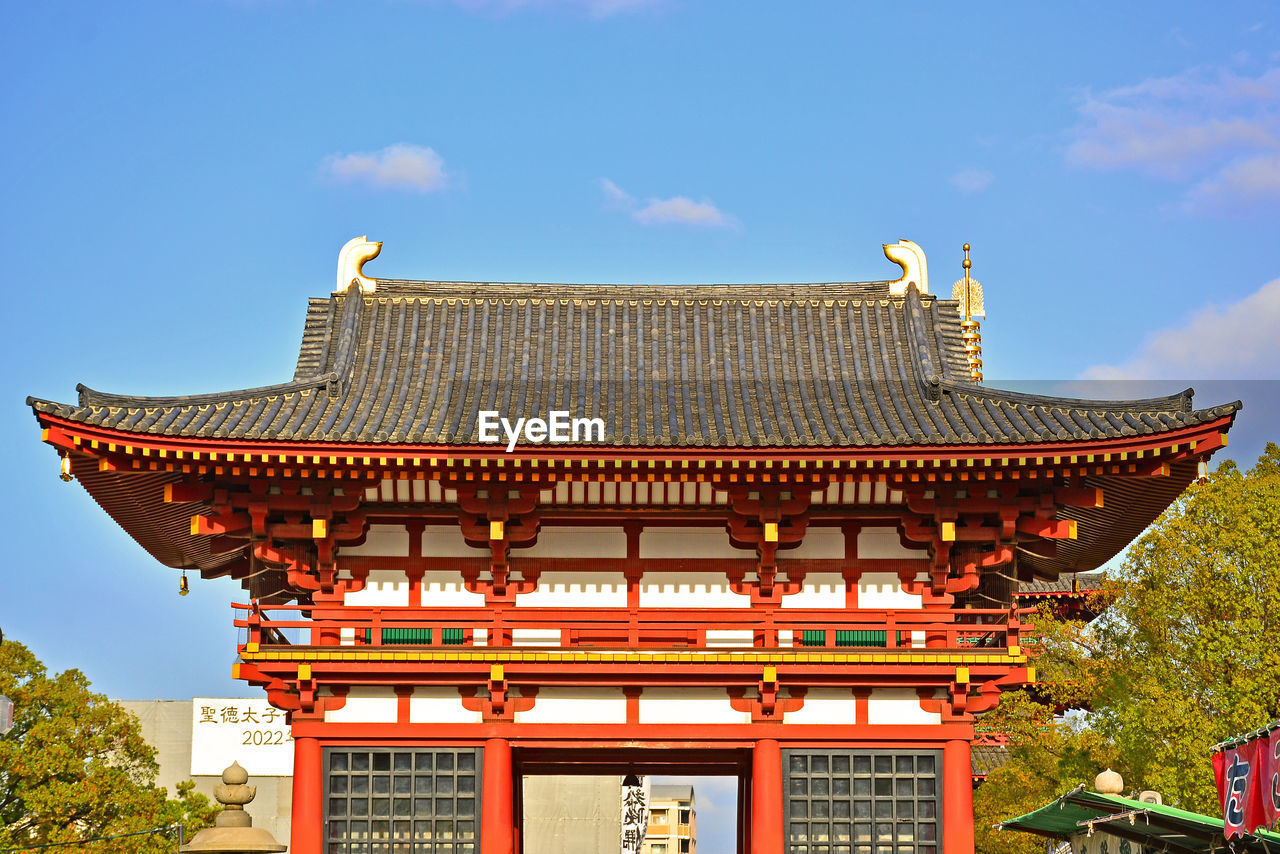 LOW ANGLE VIEW OF TEMPLE AGAINST BUILDING