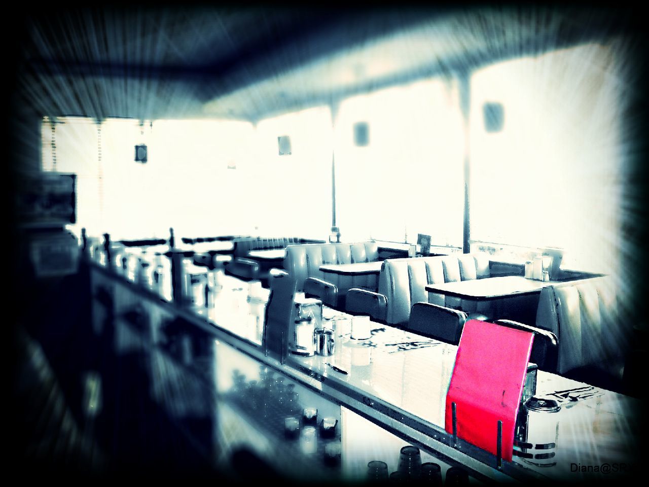 Interior of empty chairs and table in restaurant