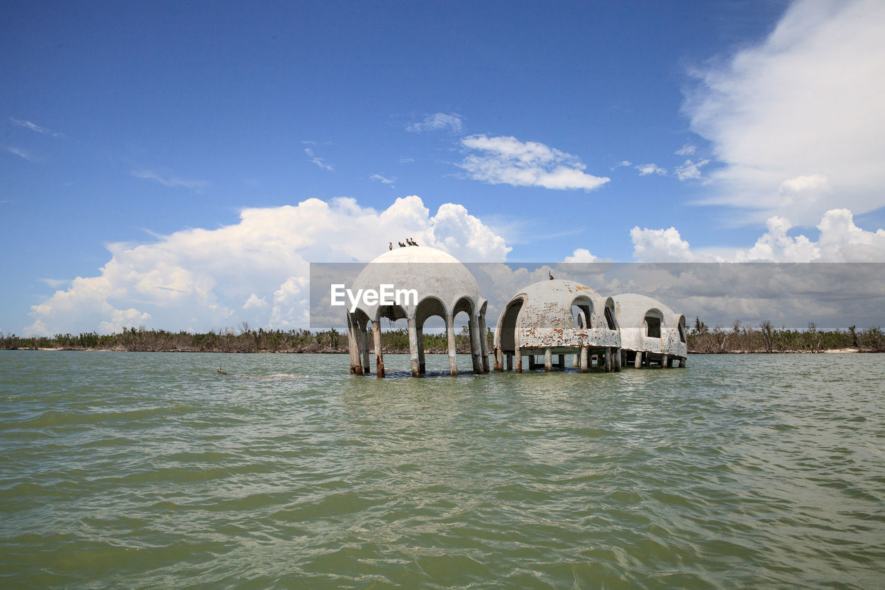 Scenic view of sea against cloudy sky