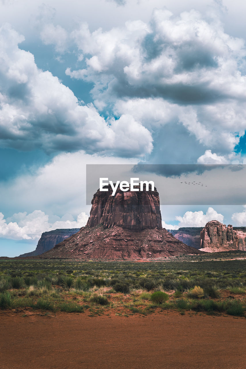 Rock mountain on landscape against sky