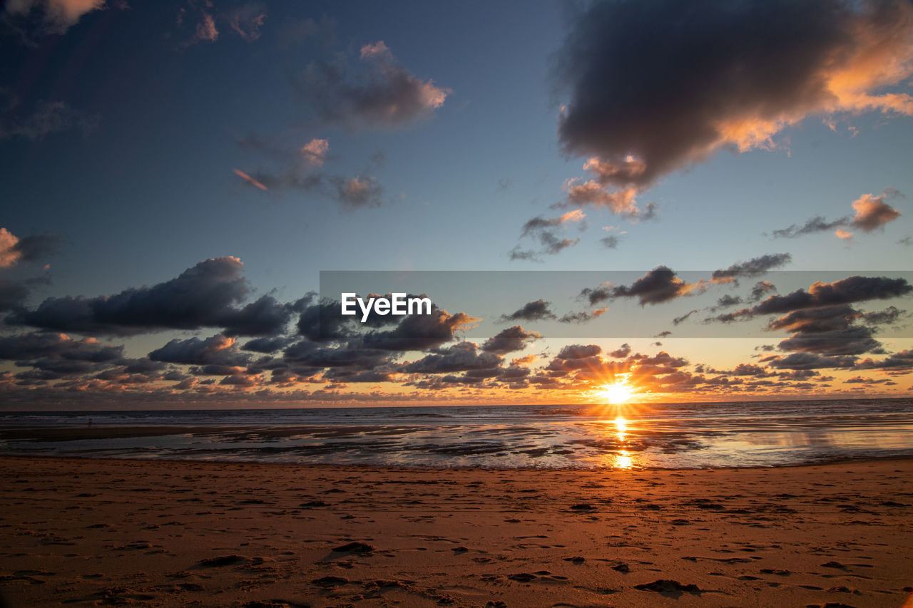 Atlantic ocean sunset with pink and purple sky, montalivet france