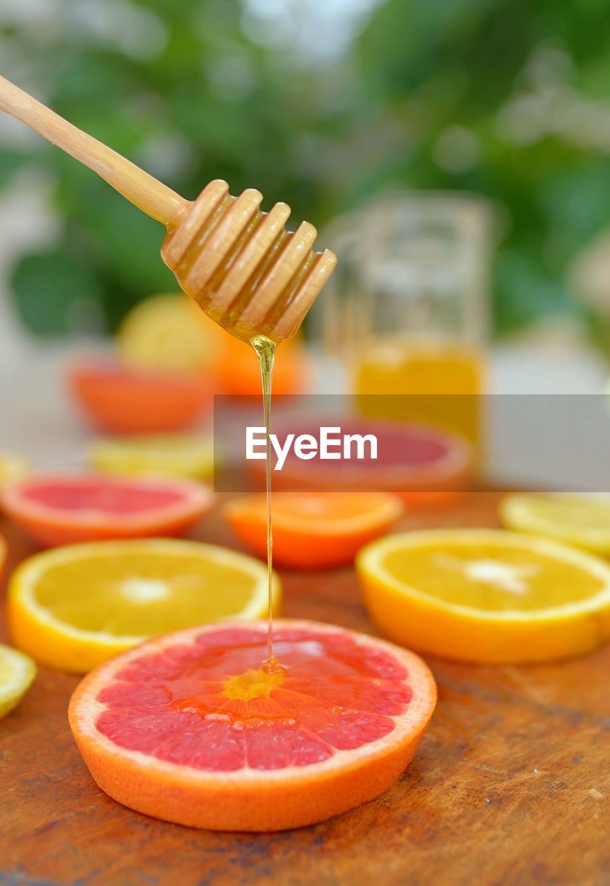 Close-up of grapefruit slices on table