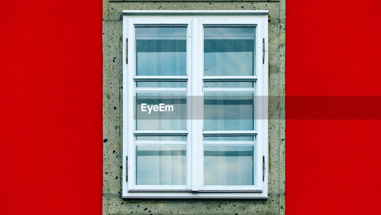 WINDOW OF RED BUILDING