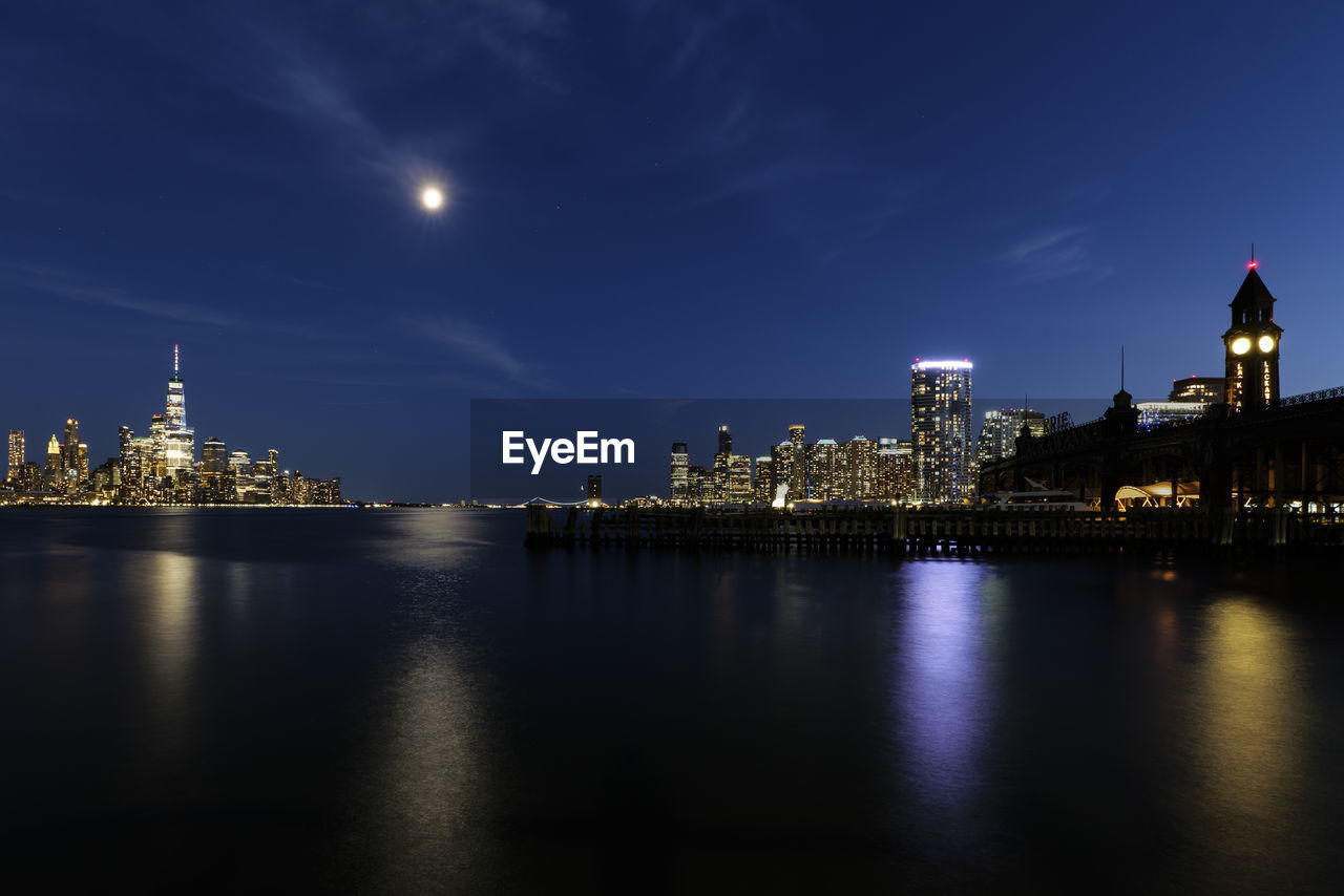 View of hoboken, nj transit terminal, and skyline of manhattan at night
