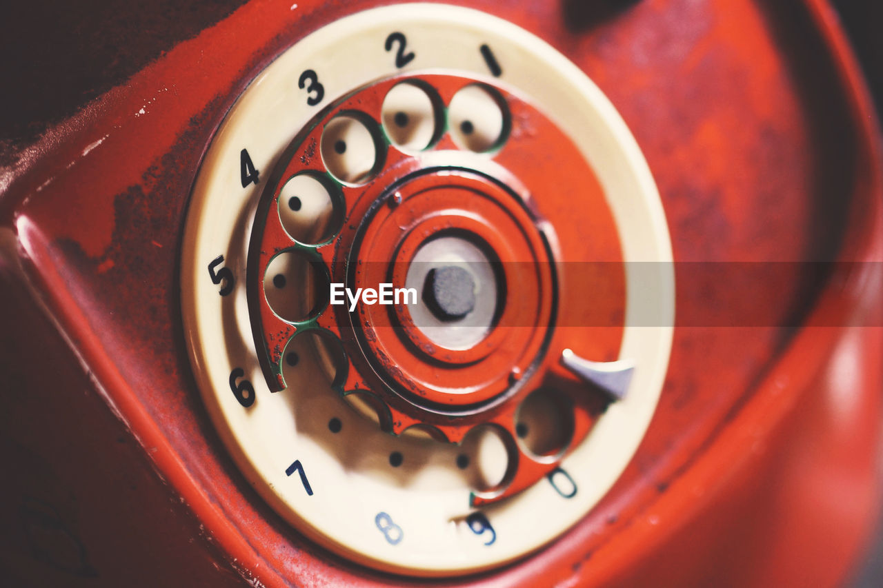 Close-up of red rotary phone