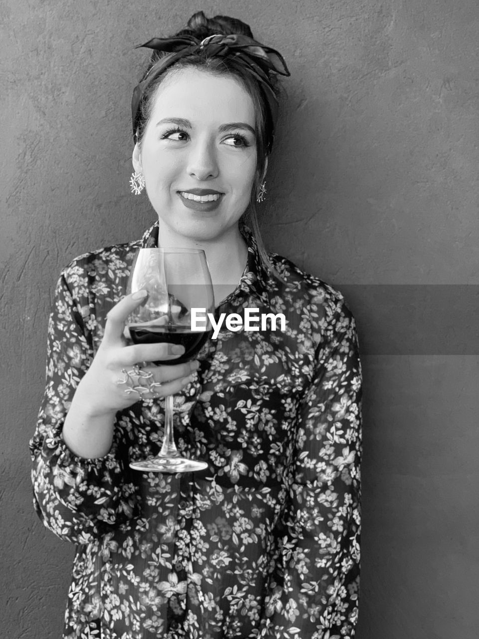 Smiling woman holding wineglass