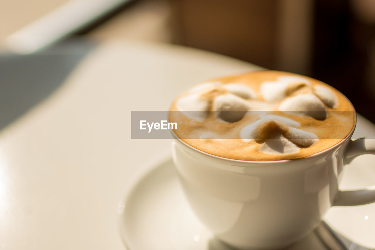 Close-up of cappuccino on table