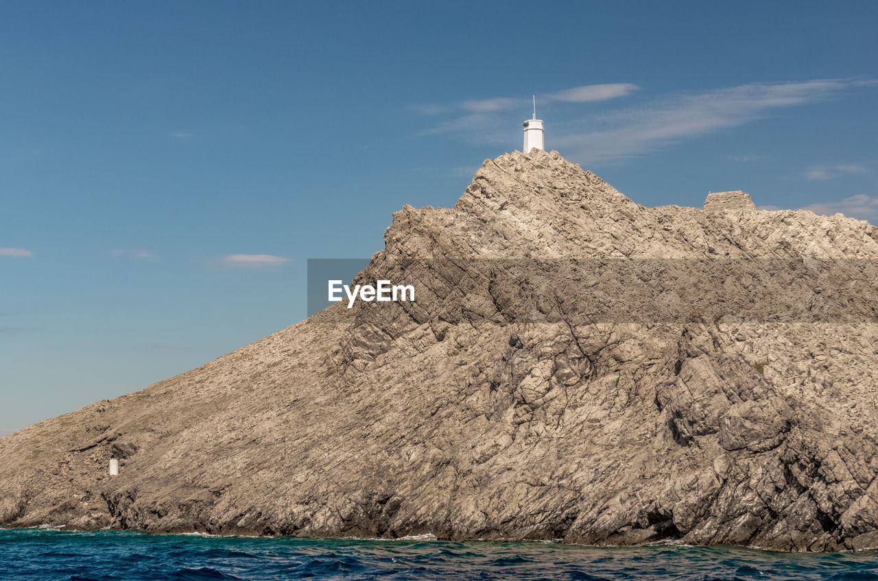 Scenic view of sea and buildings against sky