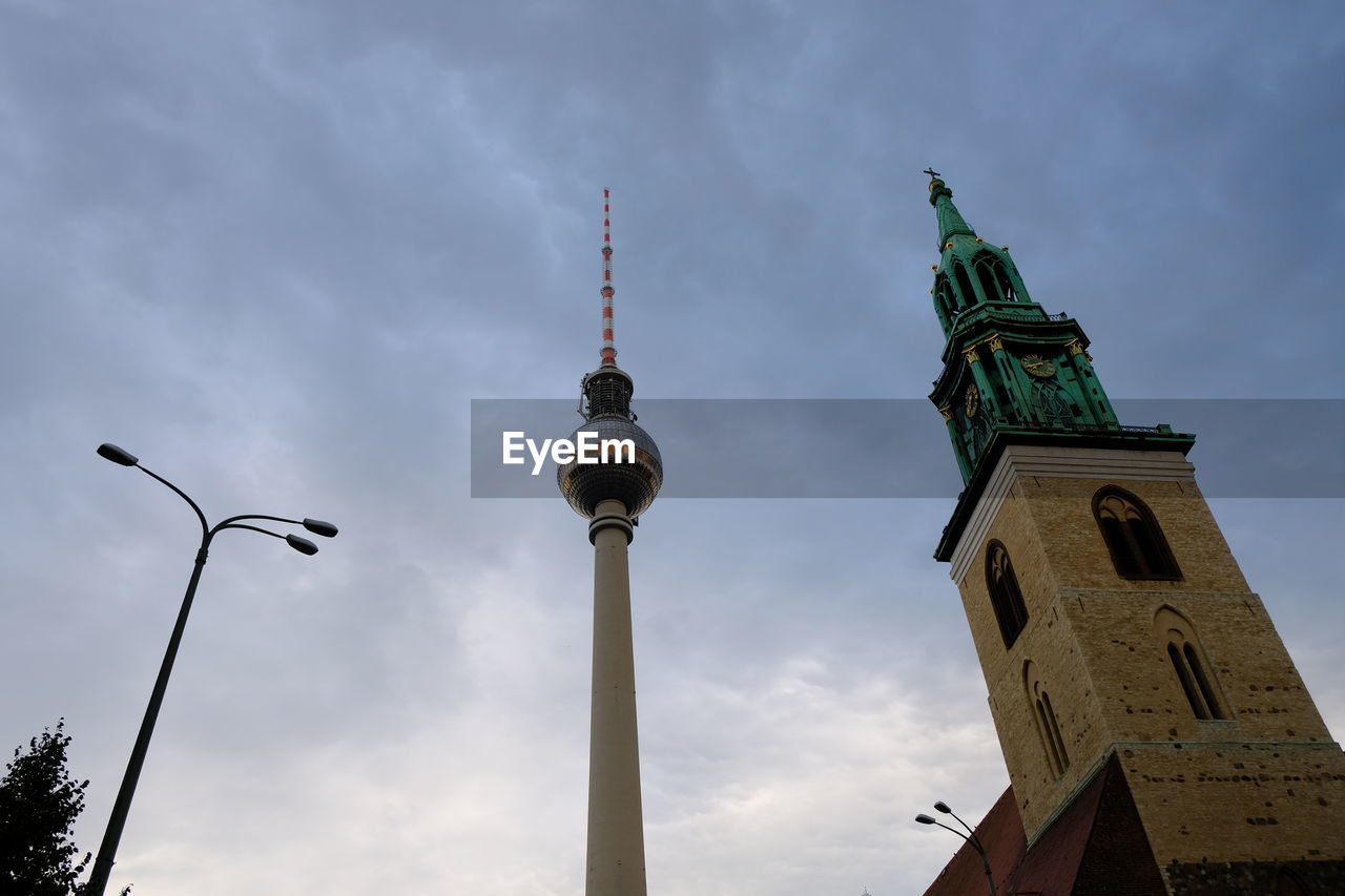 architecture, built structure, tower, sky, travel destinations, building exterior, city, landmark, cloud, building, nature, travel, spire, steeple, tourism, low angle view, street light, communications tower, no people, street, communication, outdoors, history, the past, religion, day, place of worship, technology, lighting