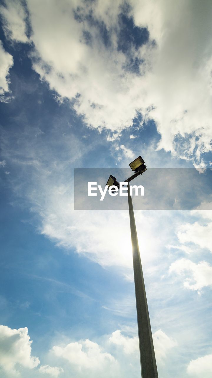 LOW ANGLE VIEW OF STREET LIGHTS AGAINST SKY