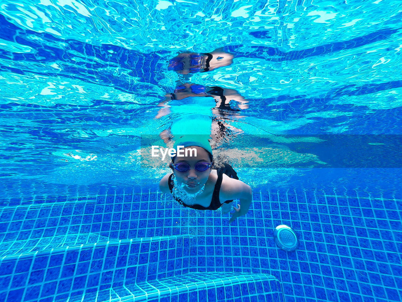 Portrait of girl swimming in pool