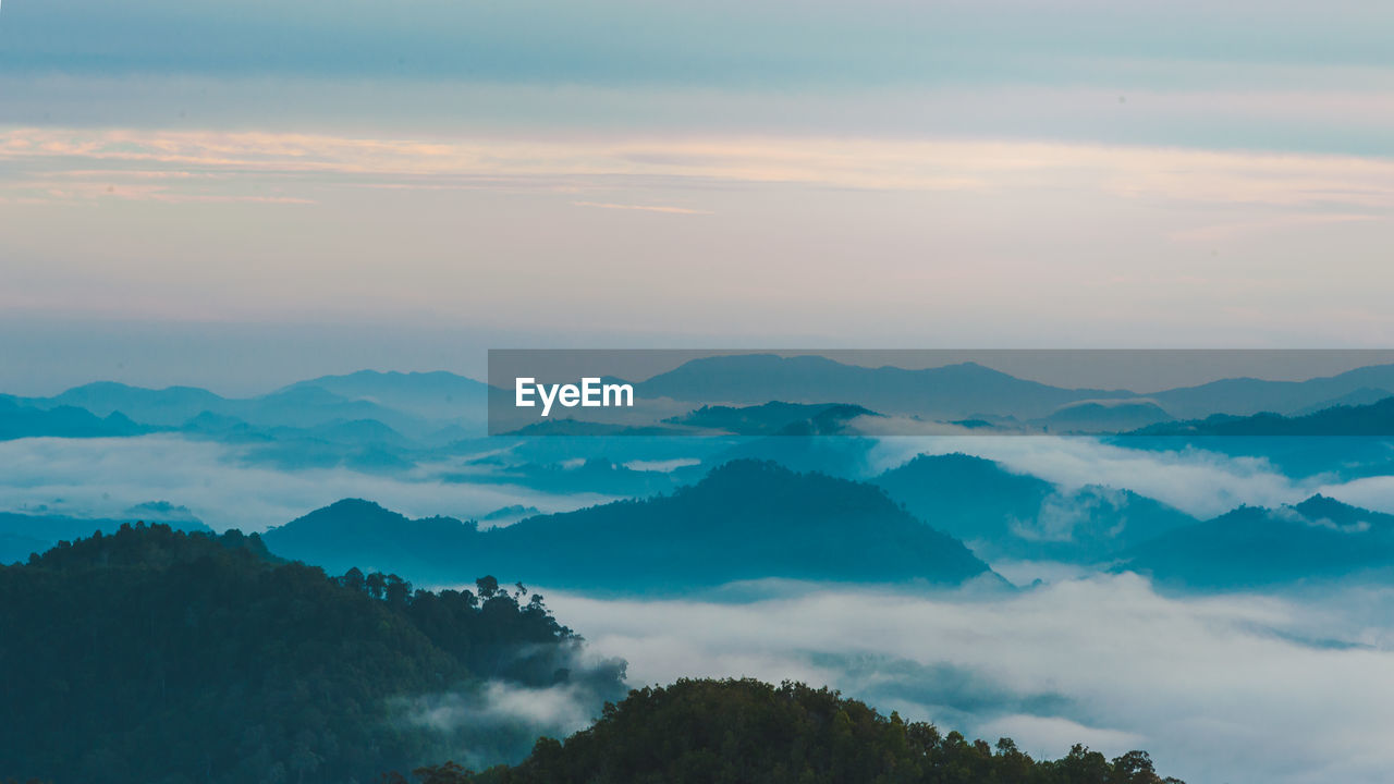 Scenic view of mountains against sky during sunset