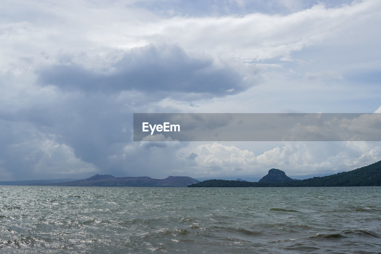 cloud, sky, water, sea, ocean, horizon, scenics - nature, beauty in nature, body of water, shore, nature, mountain, environment, coast, land, tranquility, wave, no people, tranquil scene, day, landscape, bay, wind wave, outdoors, travel, travel destinations, beach, blue, idyllic