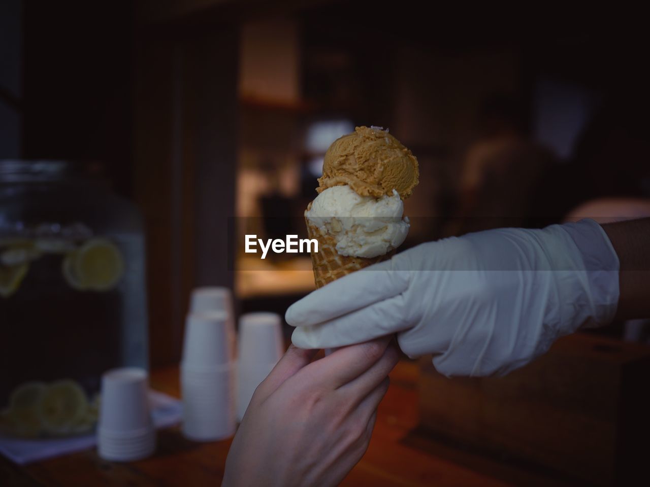 Close-up of hand holding ice cream