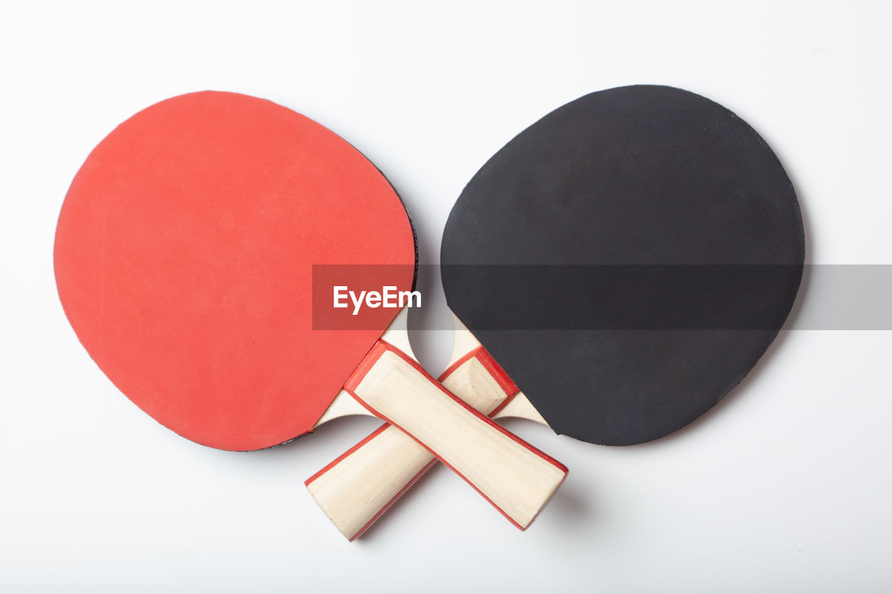 Close-up of table tennis bat on white background