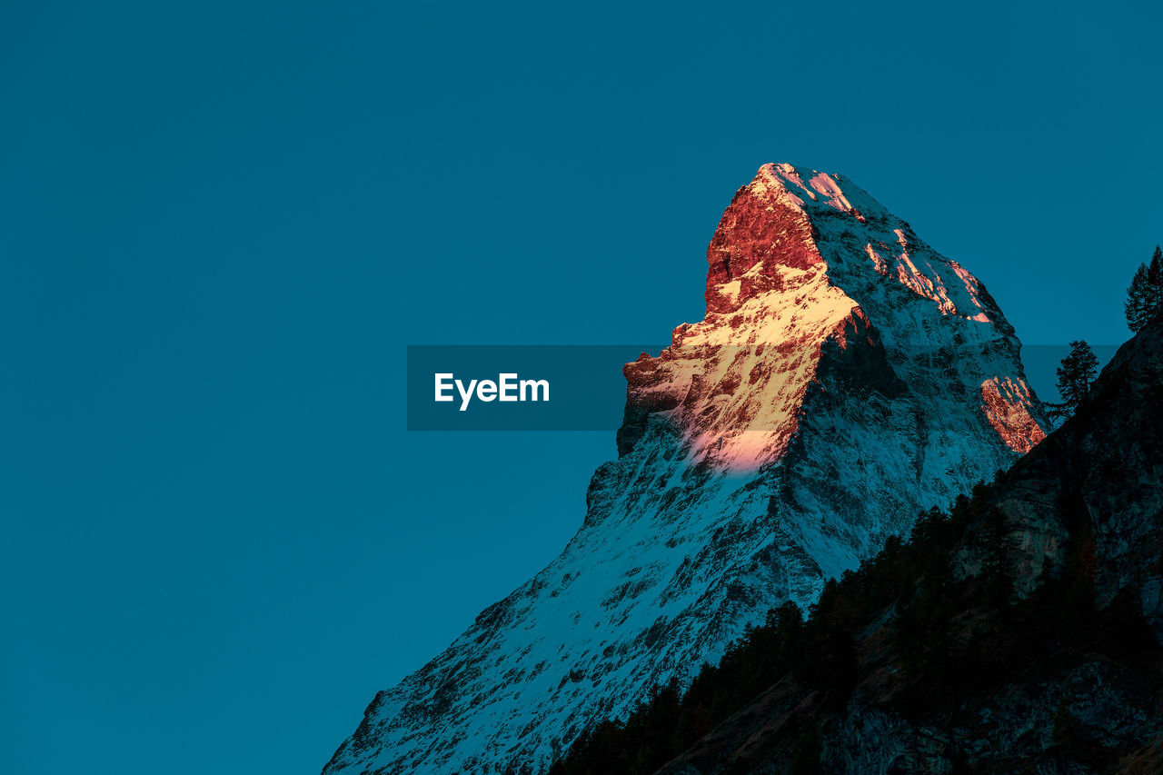 Panoramic view of the matterhorn at sunrise.