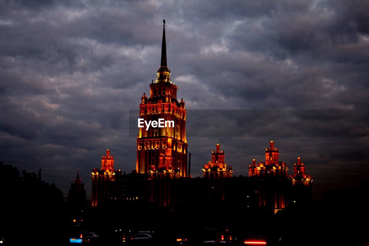 VIEW OF ILLUMINATED CITY AT NIGHT