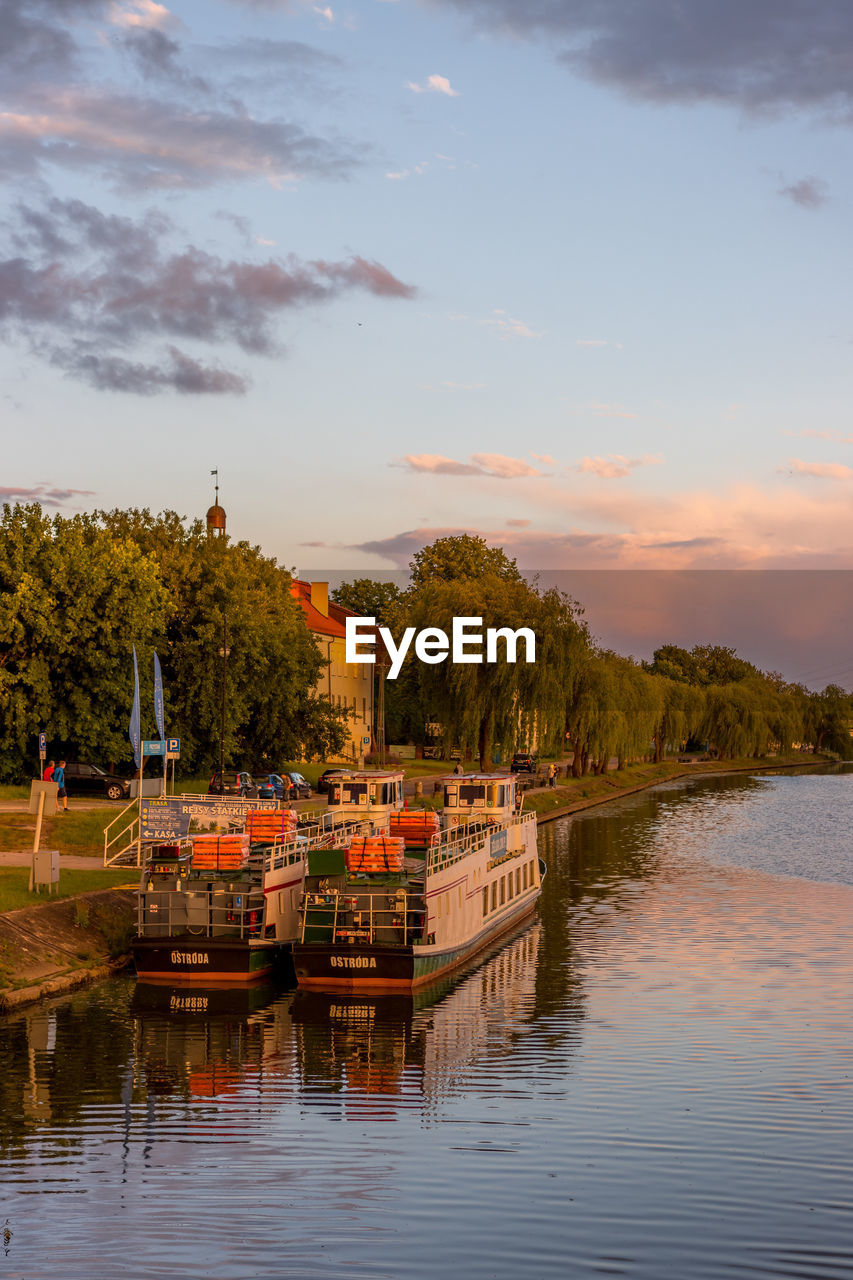 Scenic view of the river against the sky at sunset