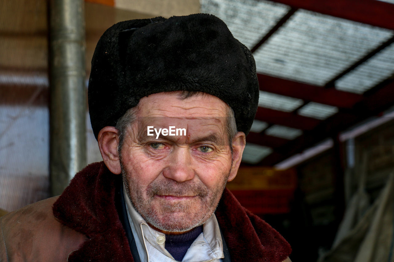 Portrait of senior man wearing hat